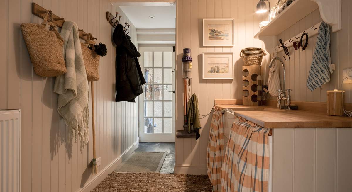 The all-important separate utility-room features a washing machine, tumble-drier and freezer.