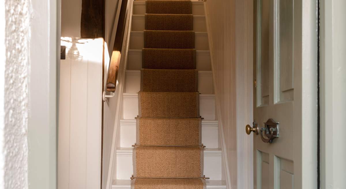 The central staircase leads to two exquisite bedrooms and the cavernous family bathroom.