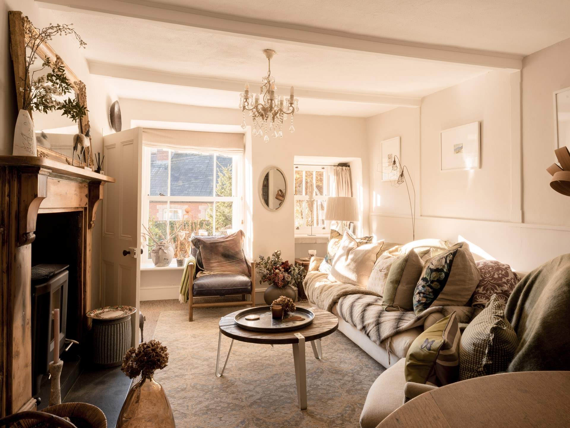 The sitting-room is a wonderful light space during the day and then the perfect cosy space with the wood-burner lit as the sun goes down.