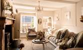 The sitting-room is a wonderful light space during the day and then the perfect cosy space with the wood-burner lit as the sun goes down. - Thumbnail Image