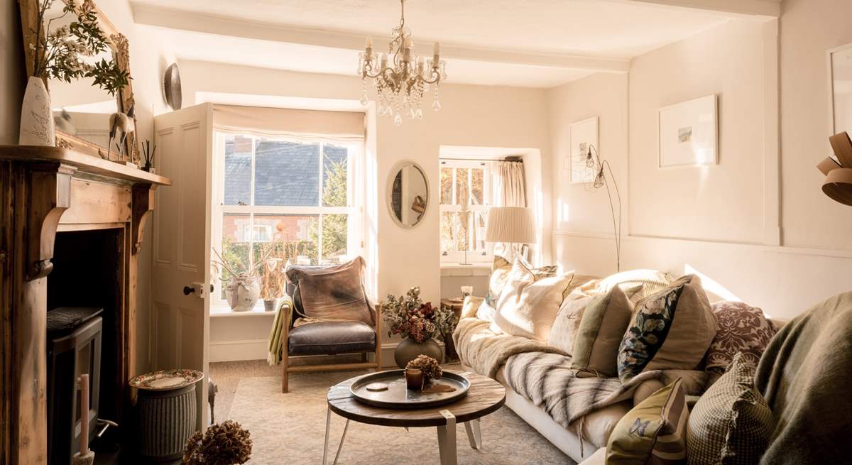 The sitting-room is a wonderful light space during the day and then the perfect cosy space with the wood-burner lit as the sun goes down.