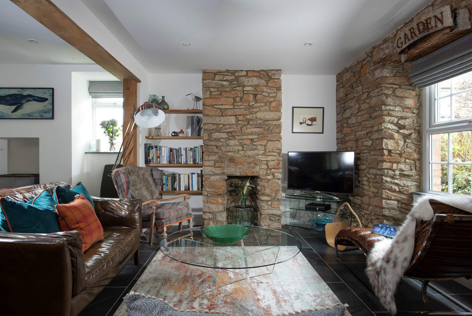 A characterful sitting-area that blends comfort, warmth and easy holiday living.