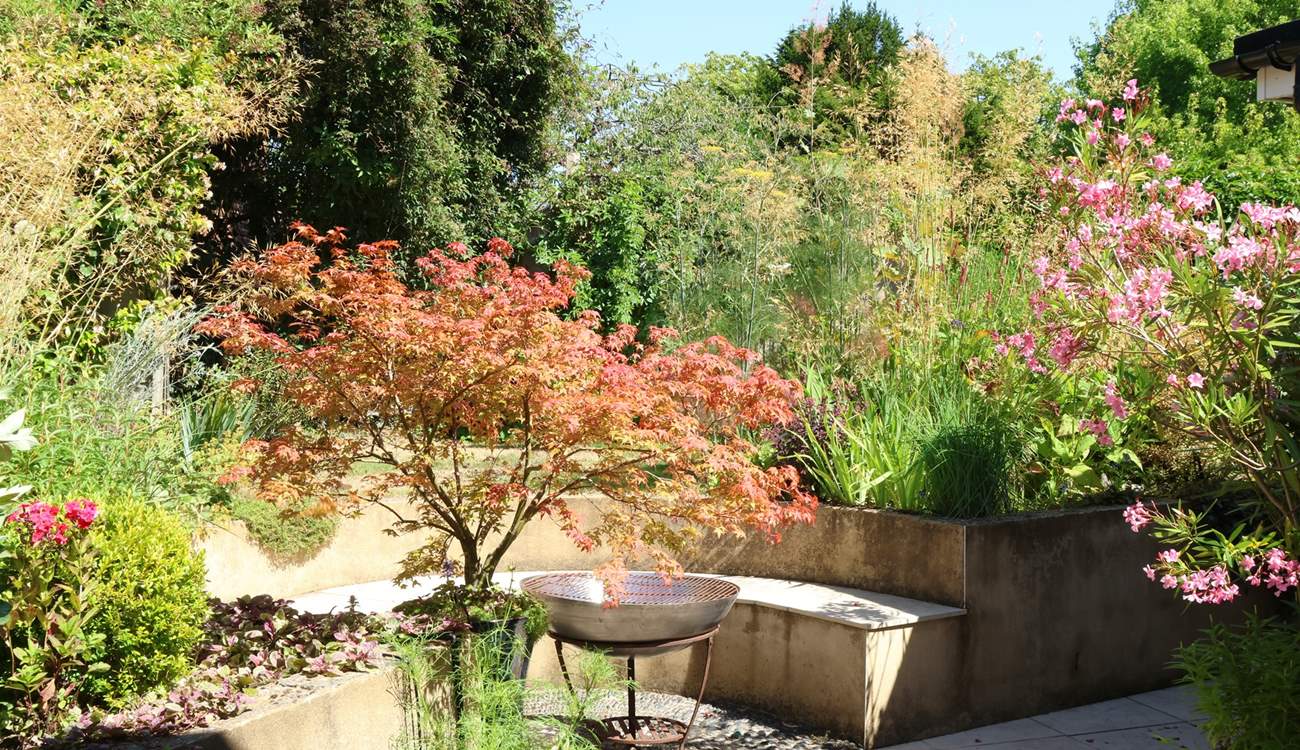 Enjoy this beautiful garden with areas the whole family can enjoy.