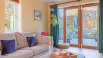 Double doors open to the patio and garden.