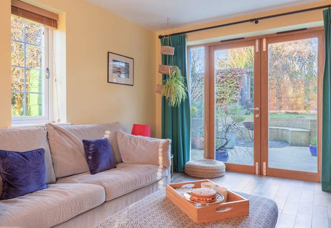 Double doors open to the patio and garden.