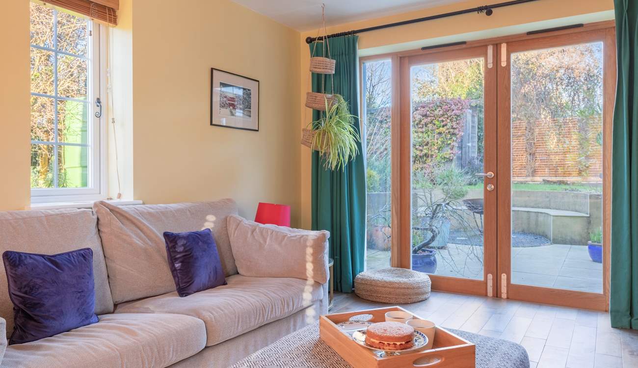 Double doors open to the patio and garden.