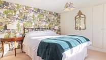 The main bedroom is so spacious and inviting.