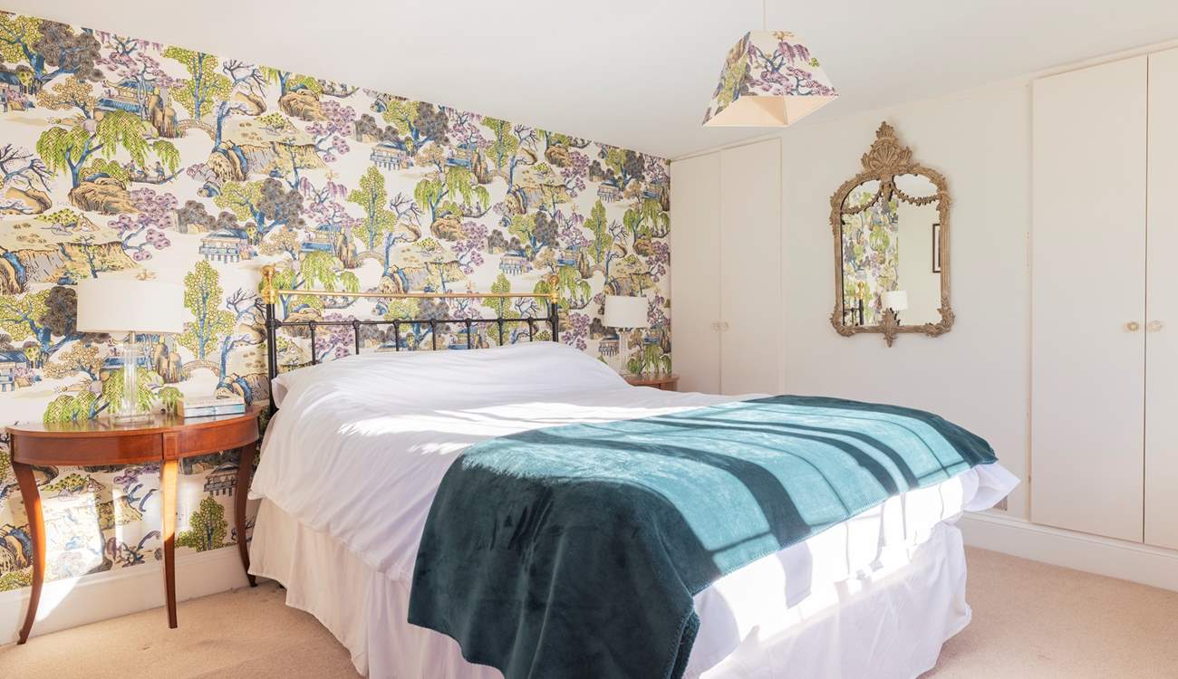 The main bedroom is so spacious and inviting.