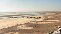 Pack a picnic, a bucket and spade and visit Camber Sands.