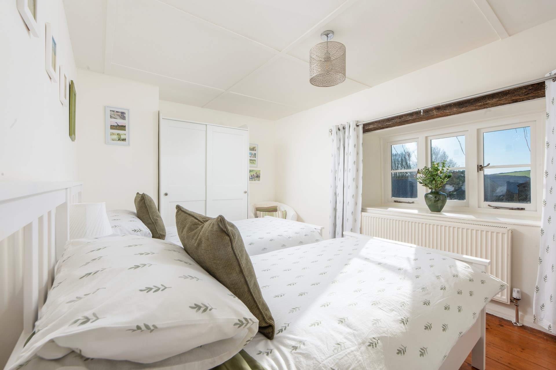 Twin beds await in the fourth bedroom.