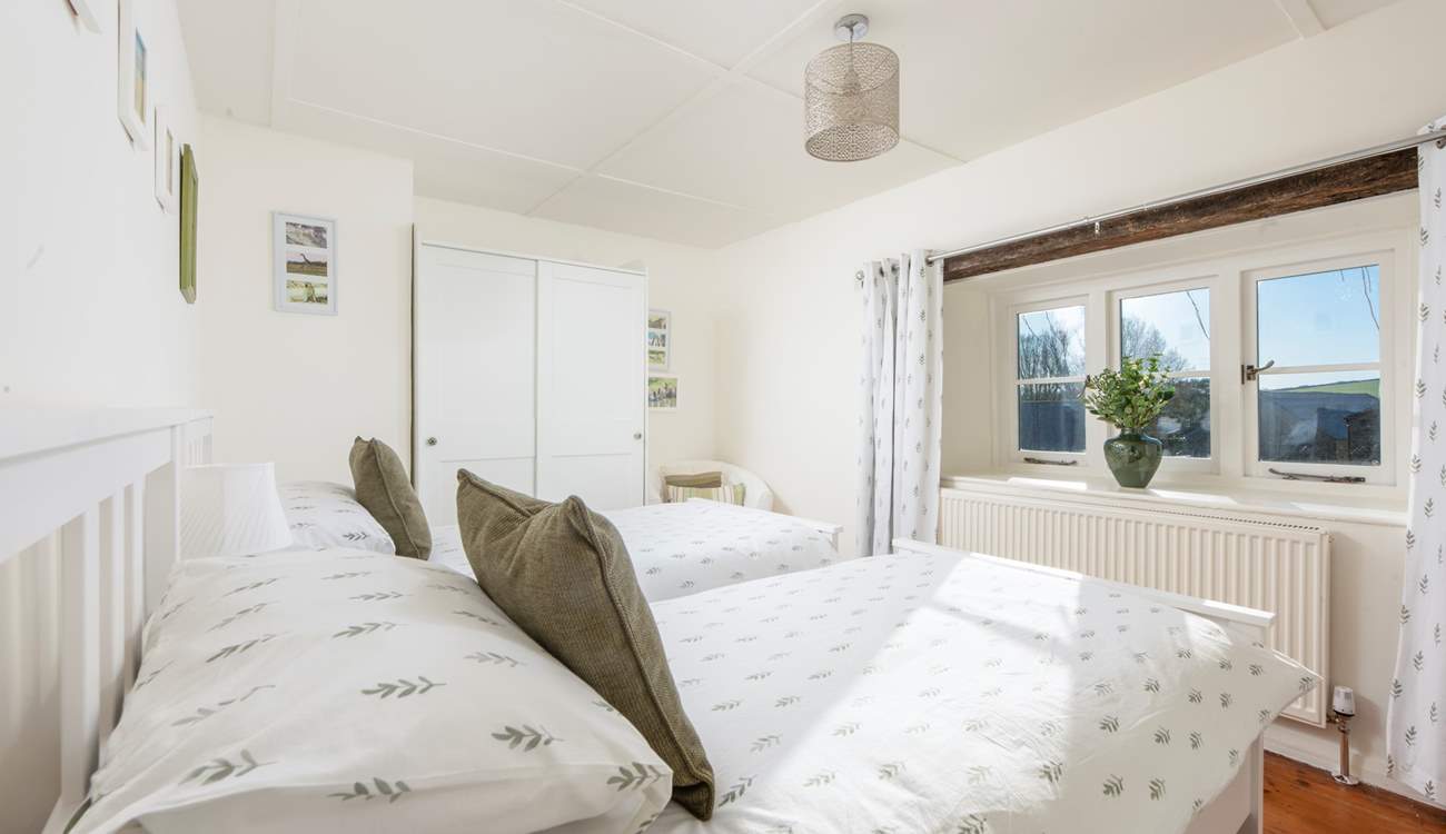 Twin beds await in the fourth bedroom.