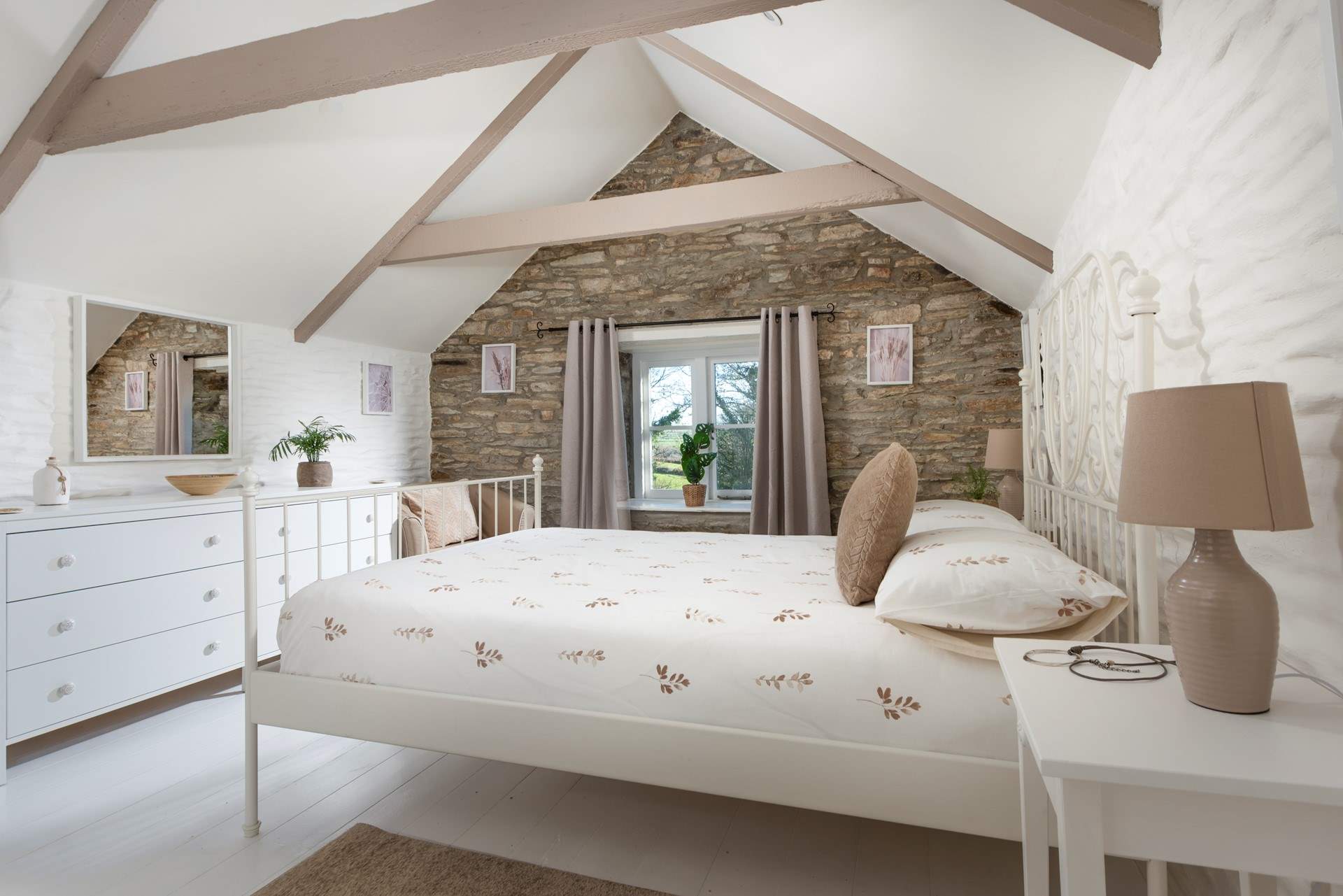 The delights continue in bedroom 3 with the exposed stone wall and vaulted ceiling adding to the overall charm and character.