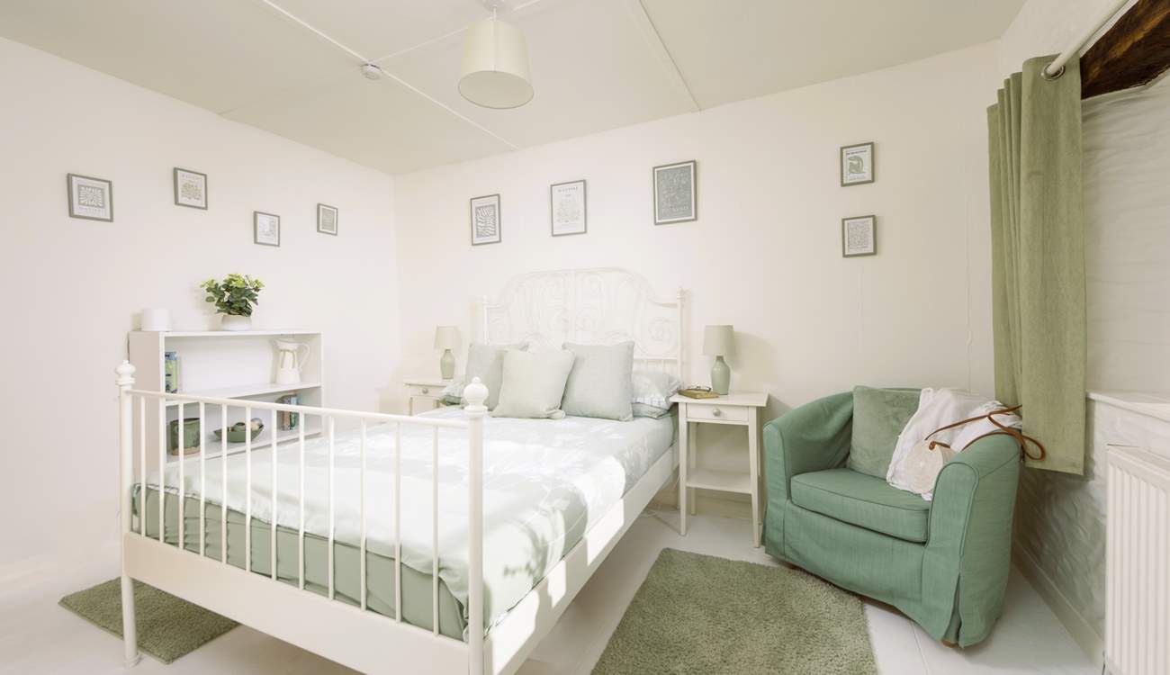 Soft shades of green make for a relaxing room.