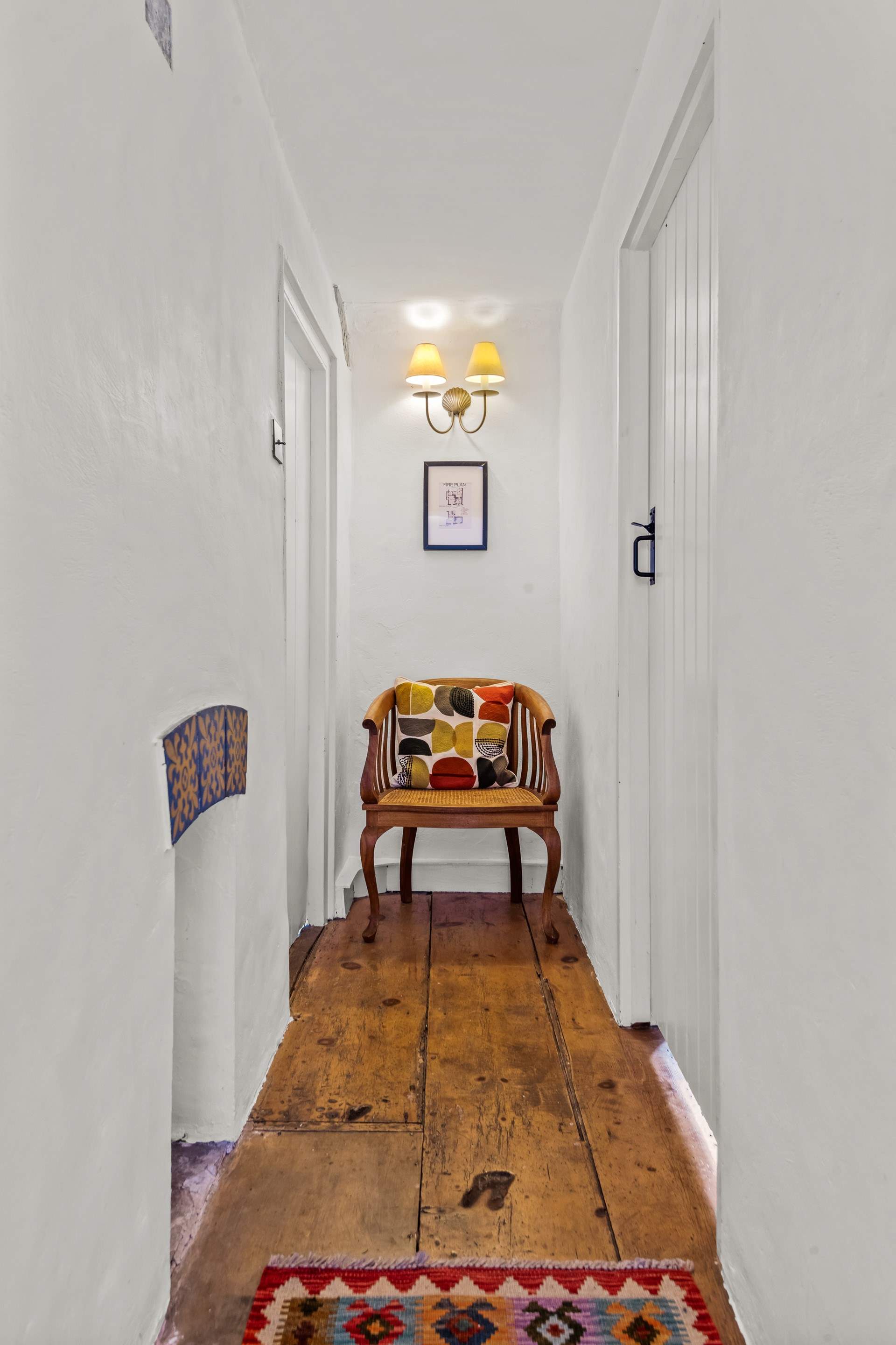 The first floor bedrooms and bathroom are linked by this bright and cheerful hallway.