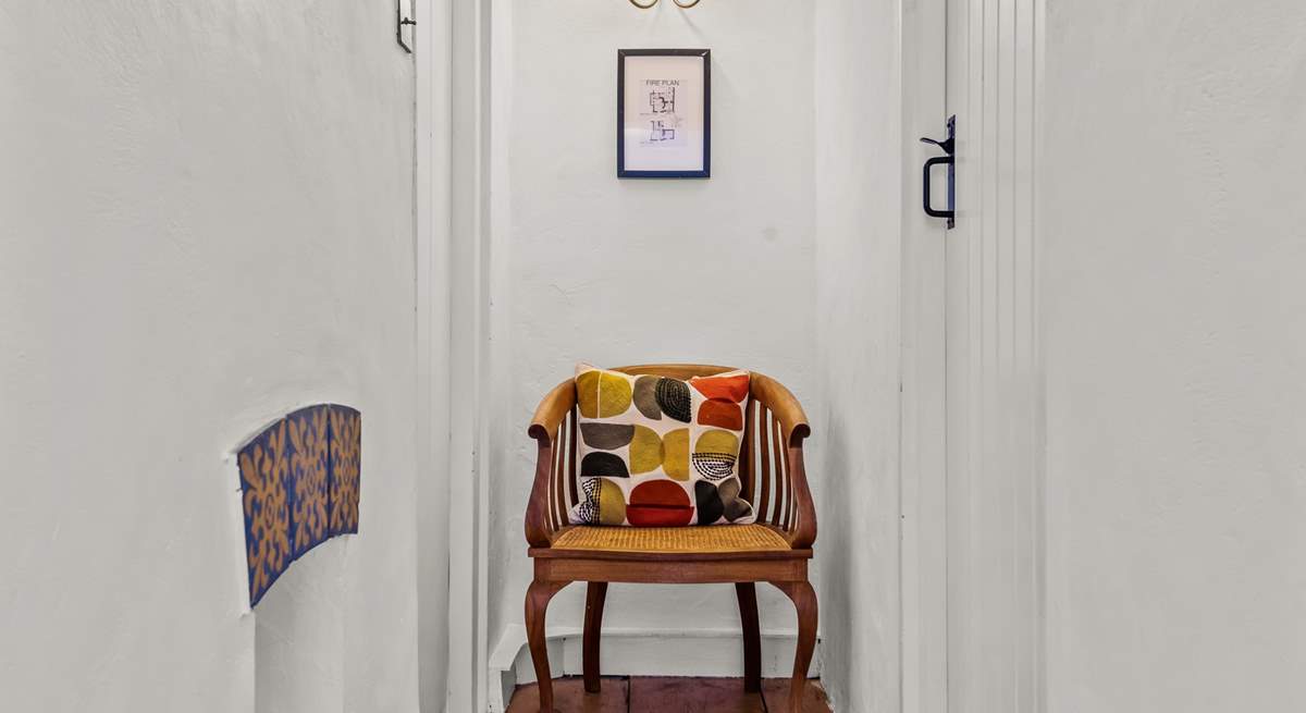 The first floor bedrooms and bathroom are linked by this bright and cheerful hallway.