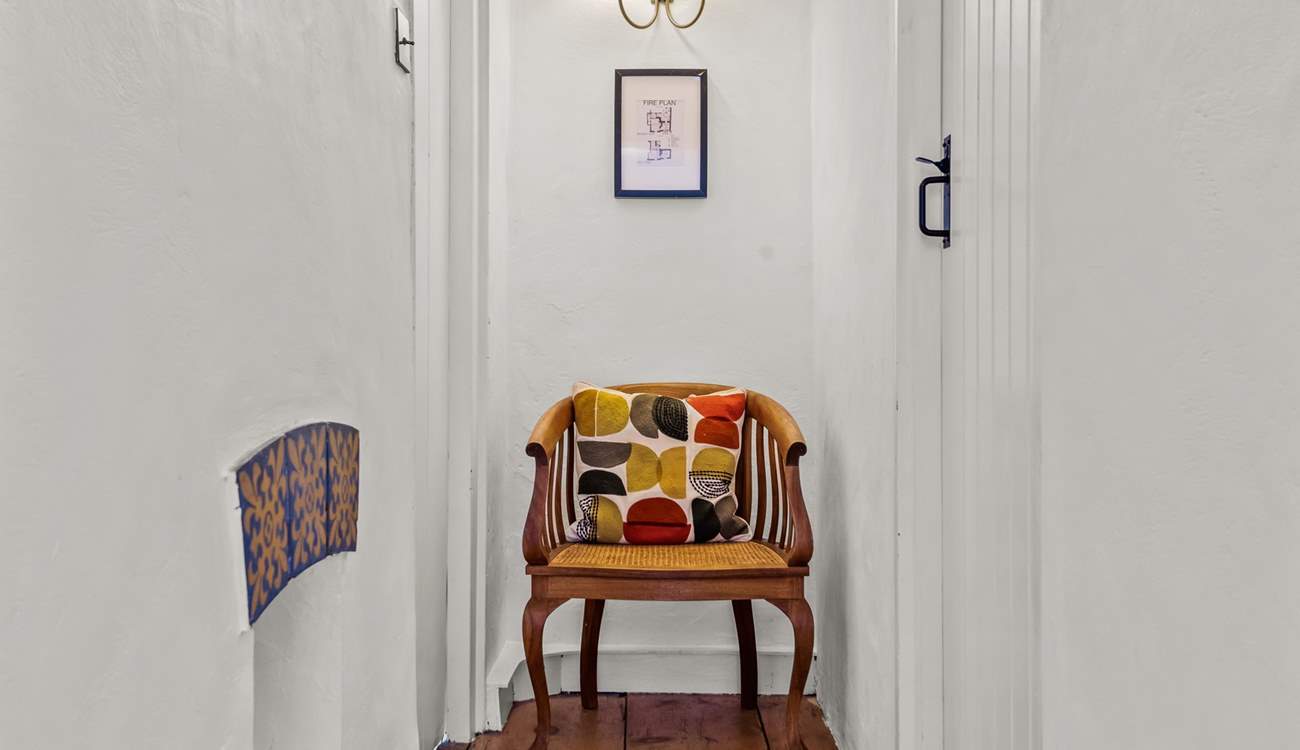 The first floor bedrooms and bathroom are linked by this bright and cheerful hallway.