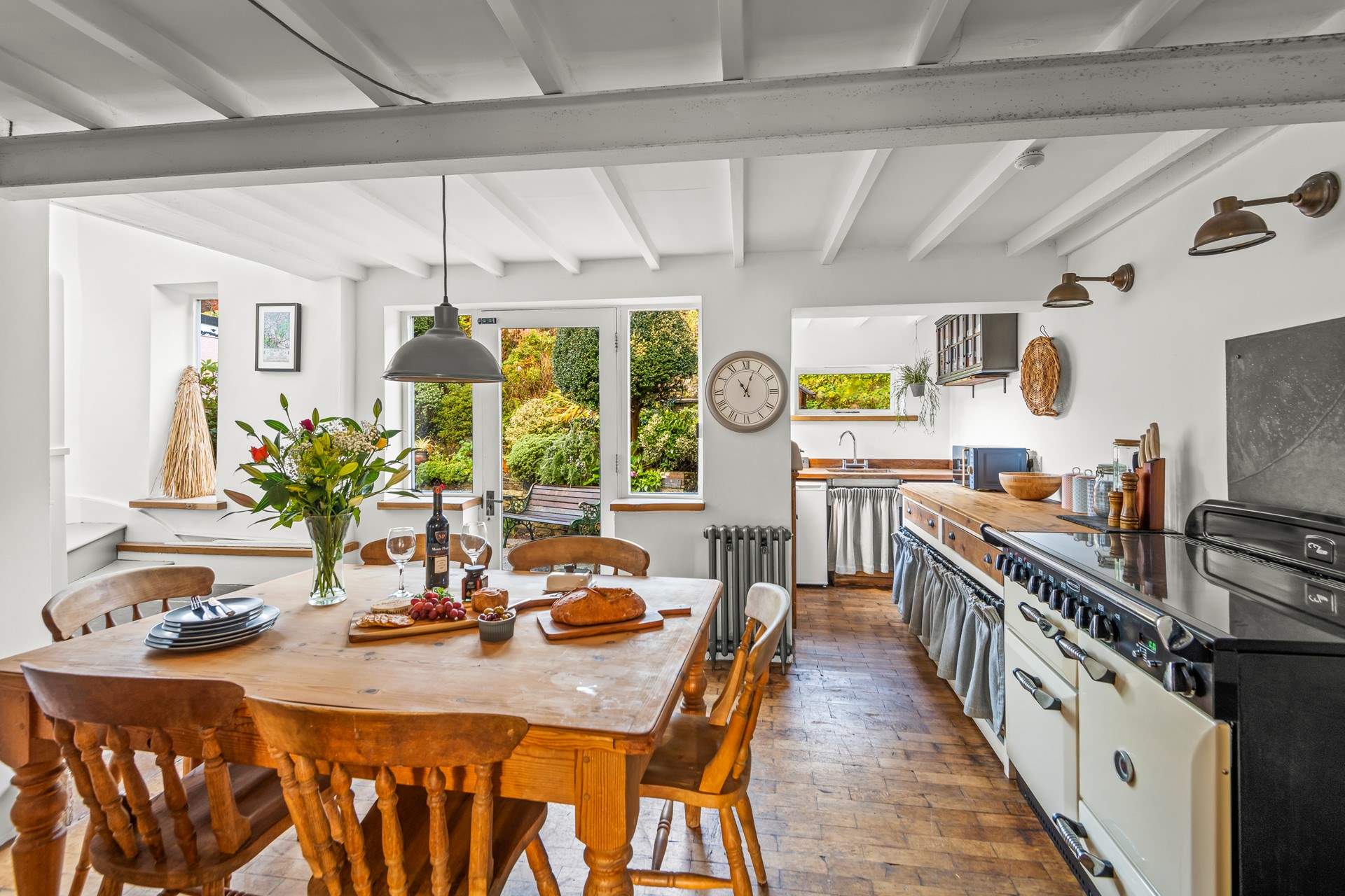 The open plan kitchen and dining-area is a bright and airy space, perfect for enjoying any meal.