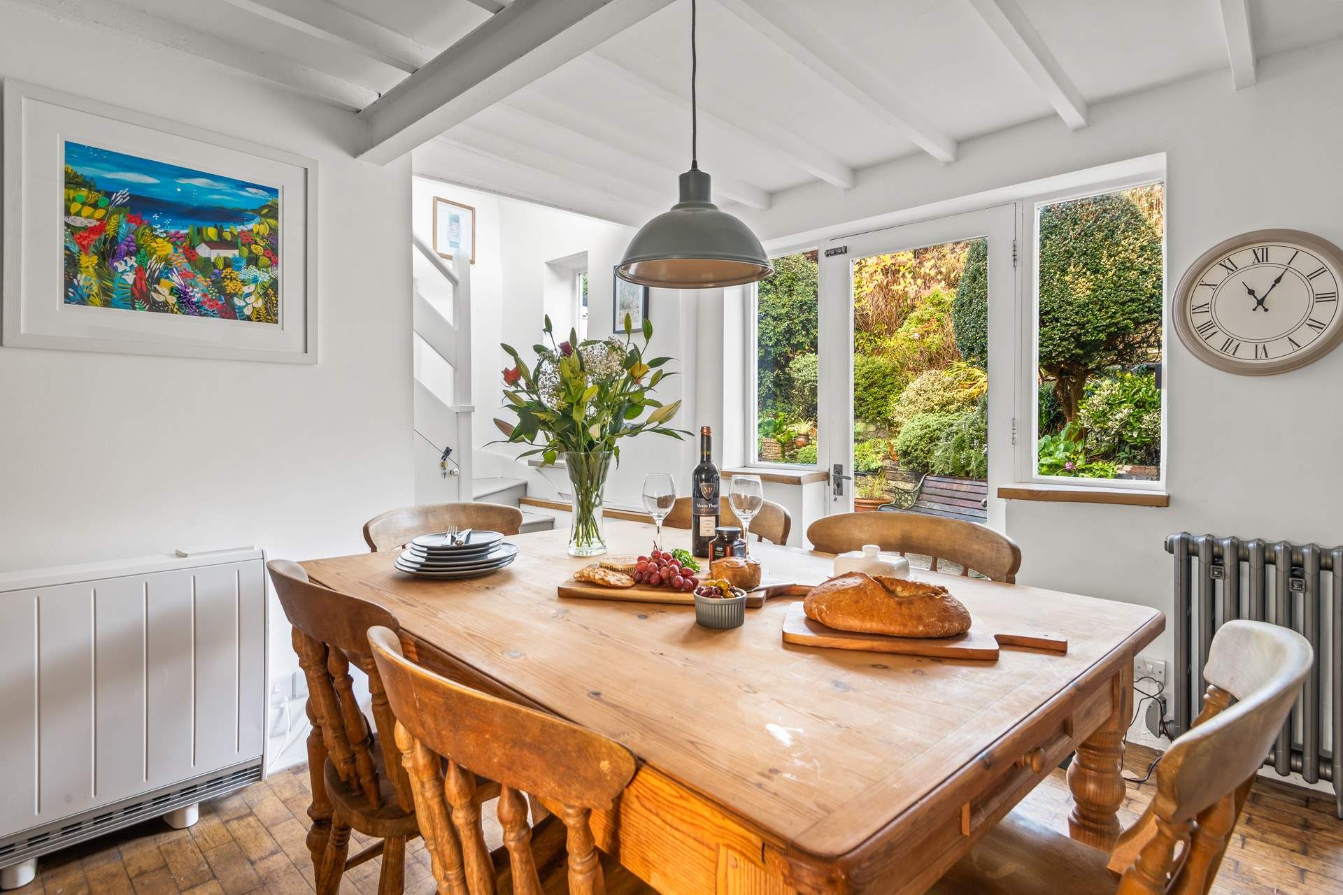 The stairs to the first floor lead up from the kitchen.