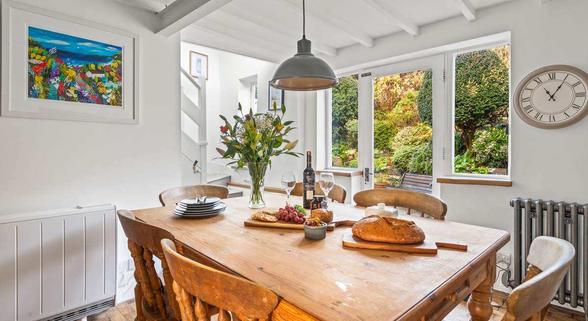 The stairs to the first floor lead up from the kitchen.