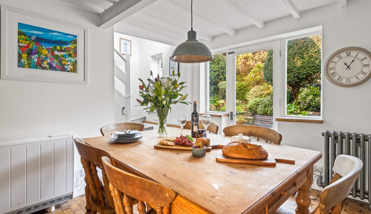 The stairs to the first floor lead up from the kitchen.