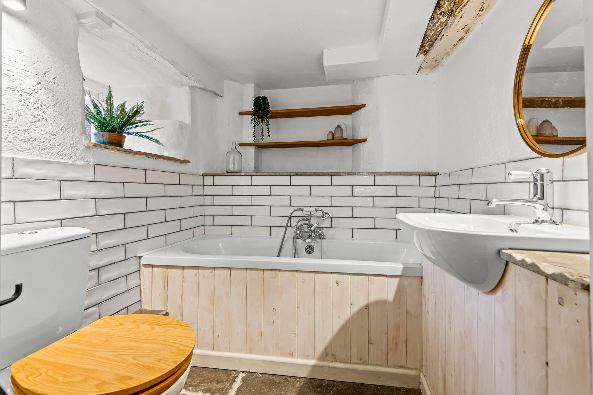 The ground floor bathroom is located conveniently through a small hallway via the sitting-room.