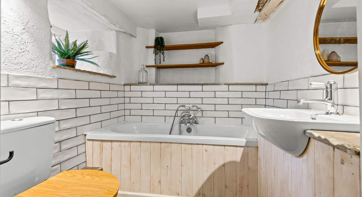 The ground floor bathroom is located conveniently through a small hallway via the sitting-room.