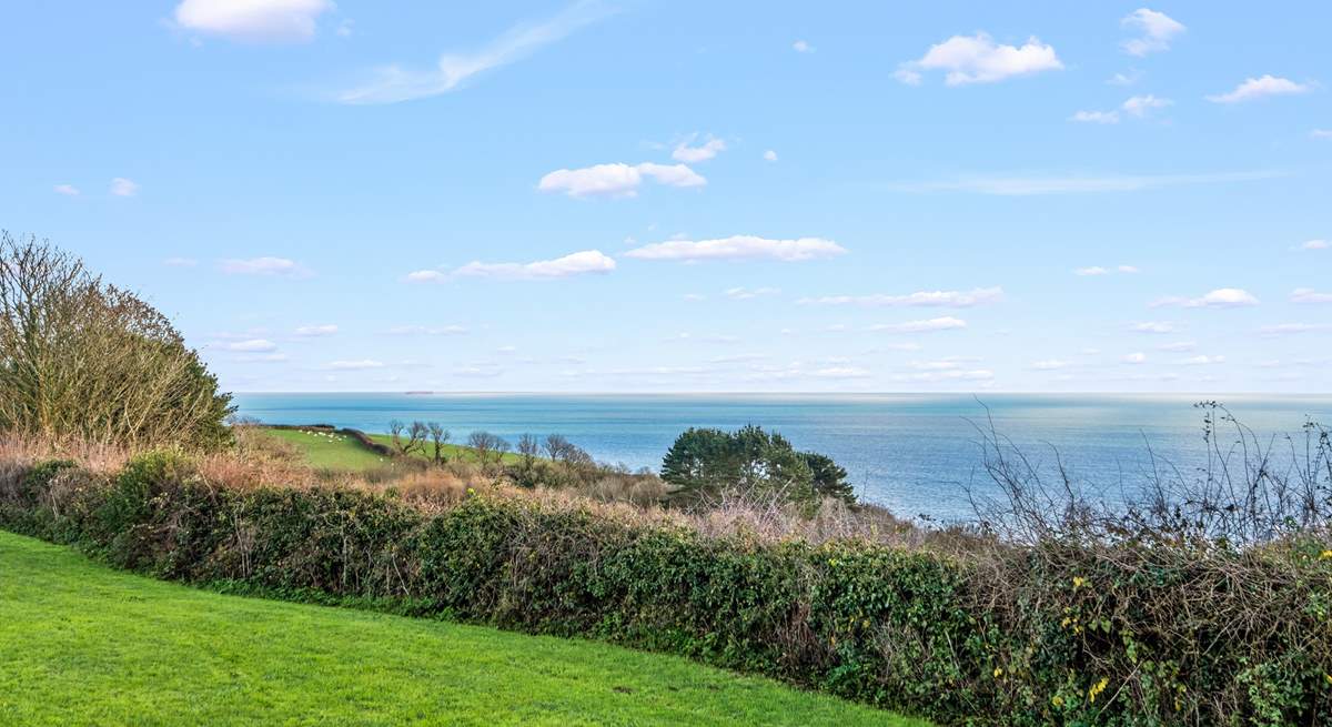 Magnificent countryside and sea views can be enjoyed from the top garden seating area.