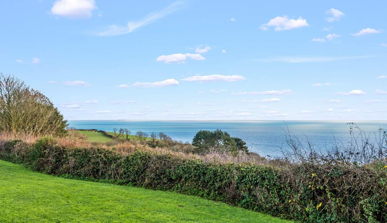 Magnificent countryside and sea views can be enjoyed from the top garden seating area.