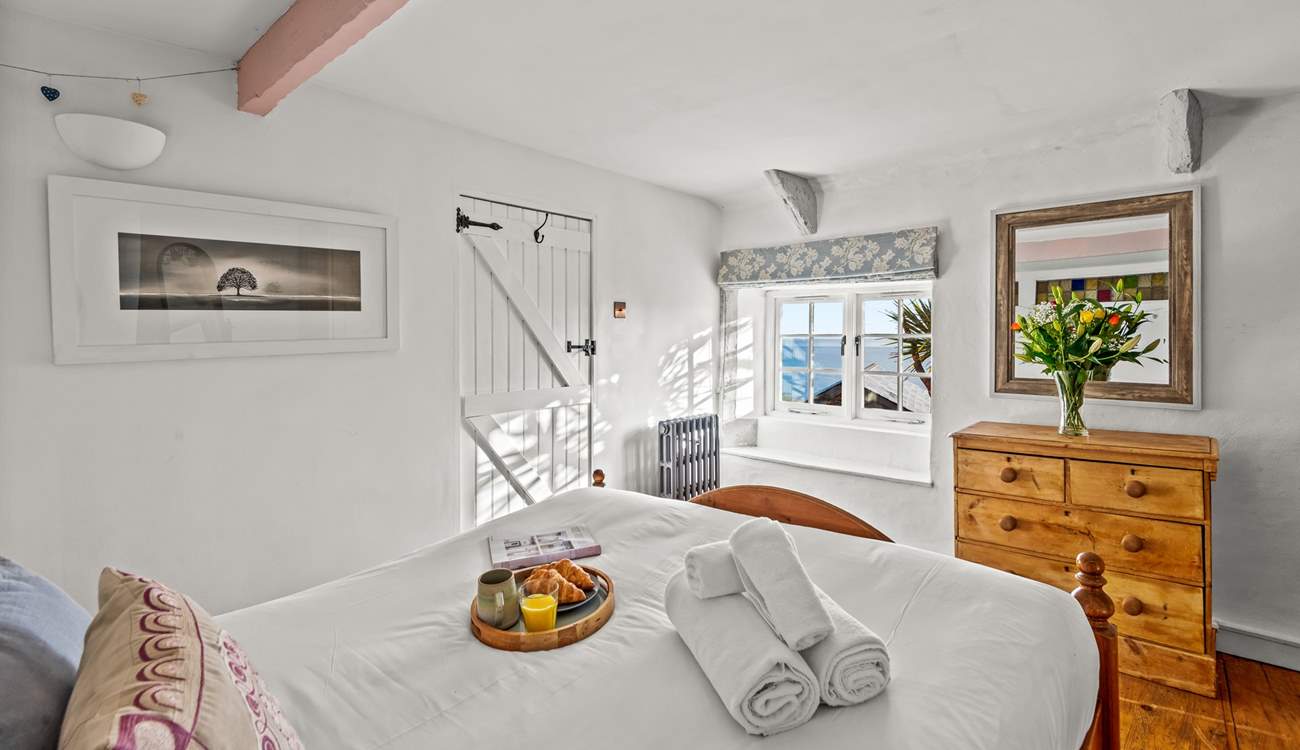 Bedroom 1 is bright and airy, with great views out to sea.