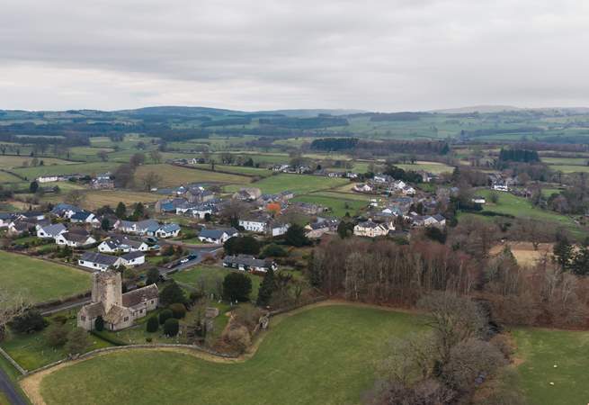Barbon from the air with the local church and the rolling hills and fields beyond.
