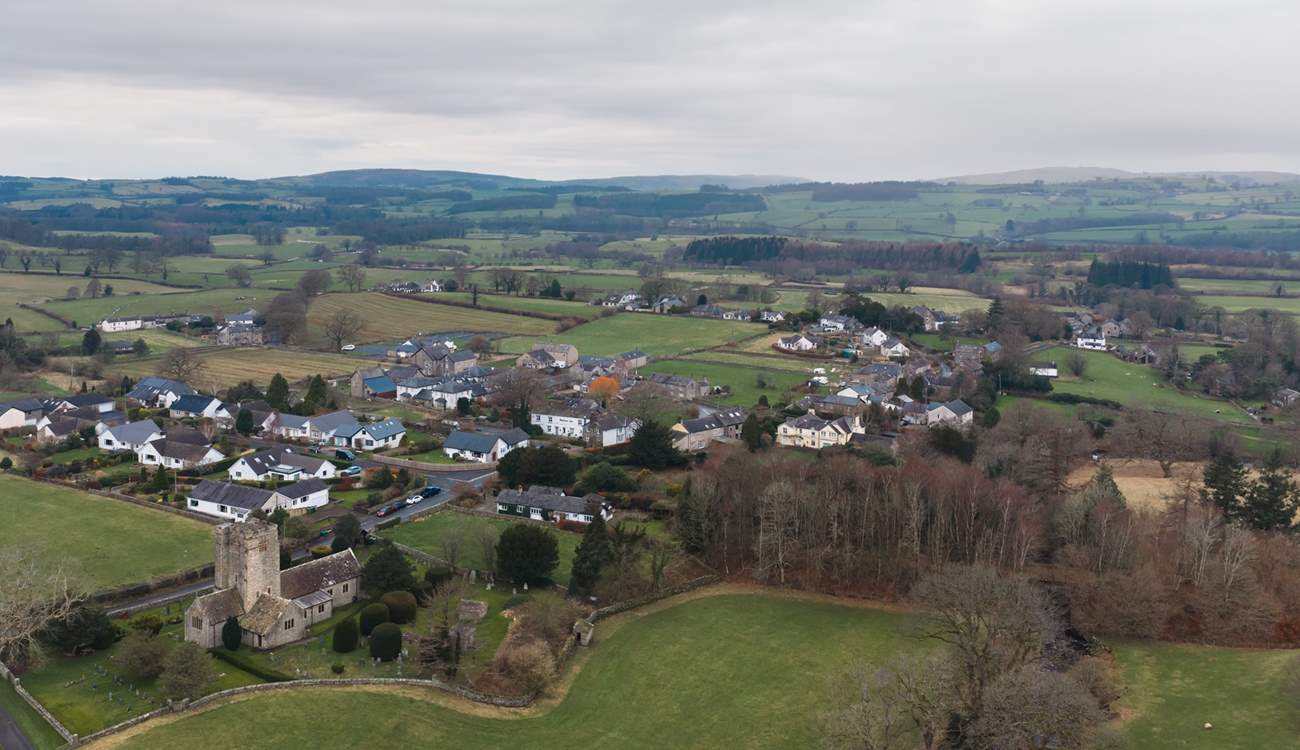 Barbon from the air with the local church and the rolling hills and fields beyond.