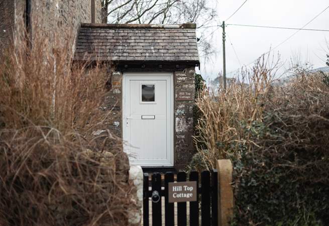 The front door to picturesque Hill Top Cottage. 