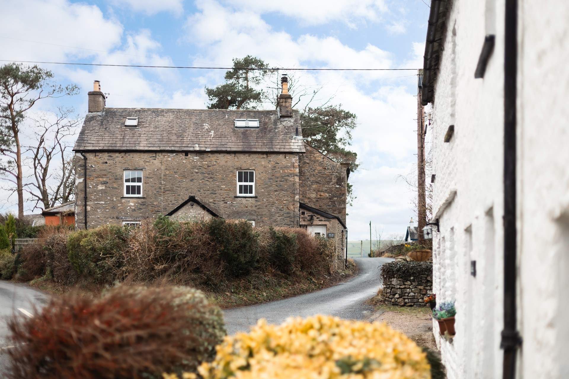 The cottage is built of traditional stone and sits atop the village. 