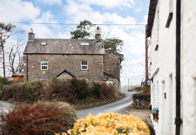 The cottage is built of traditional stone and sits atop the village. 
