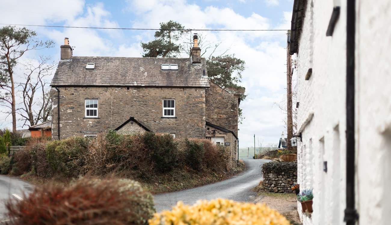 The cottage is built of traditional stone and sits atop the village. 