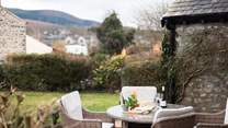Dine in the garden with a stunning backdrop.