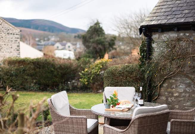 Dine in the garden with a stunning backdrop.