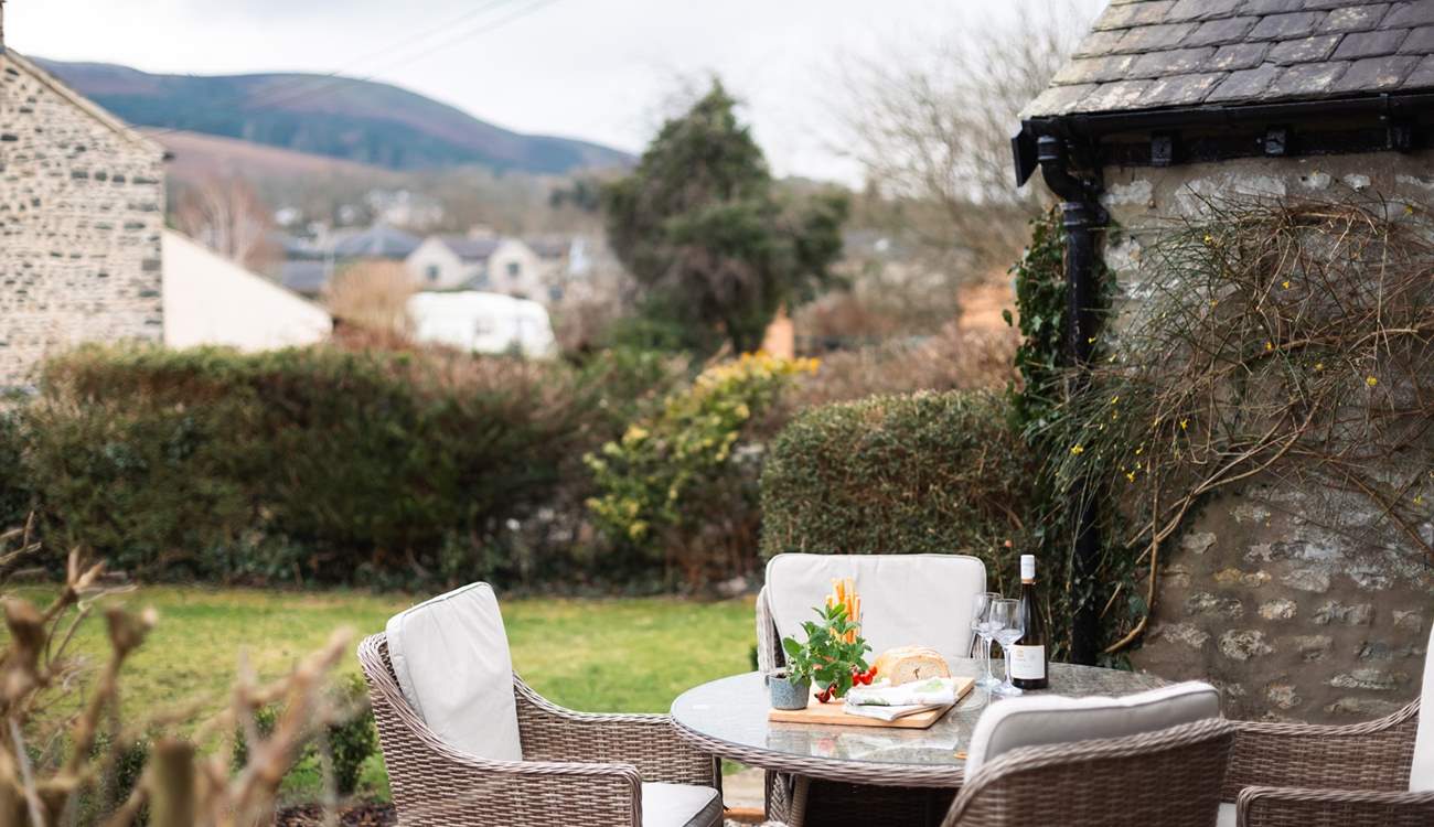 Dine in the garden with a stunning backdrop.