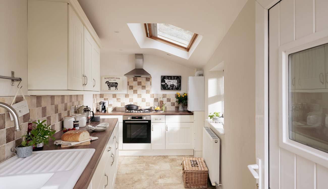 The sleek and contemporary kitchen has all the mod cons you need. 