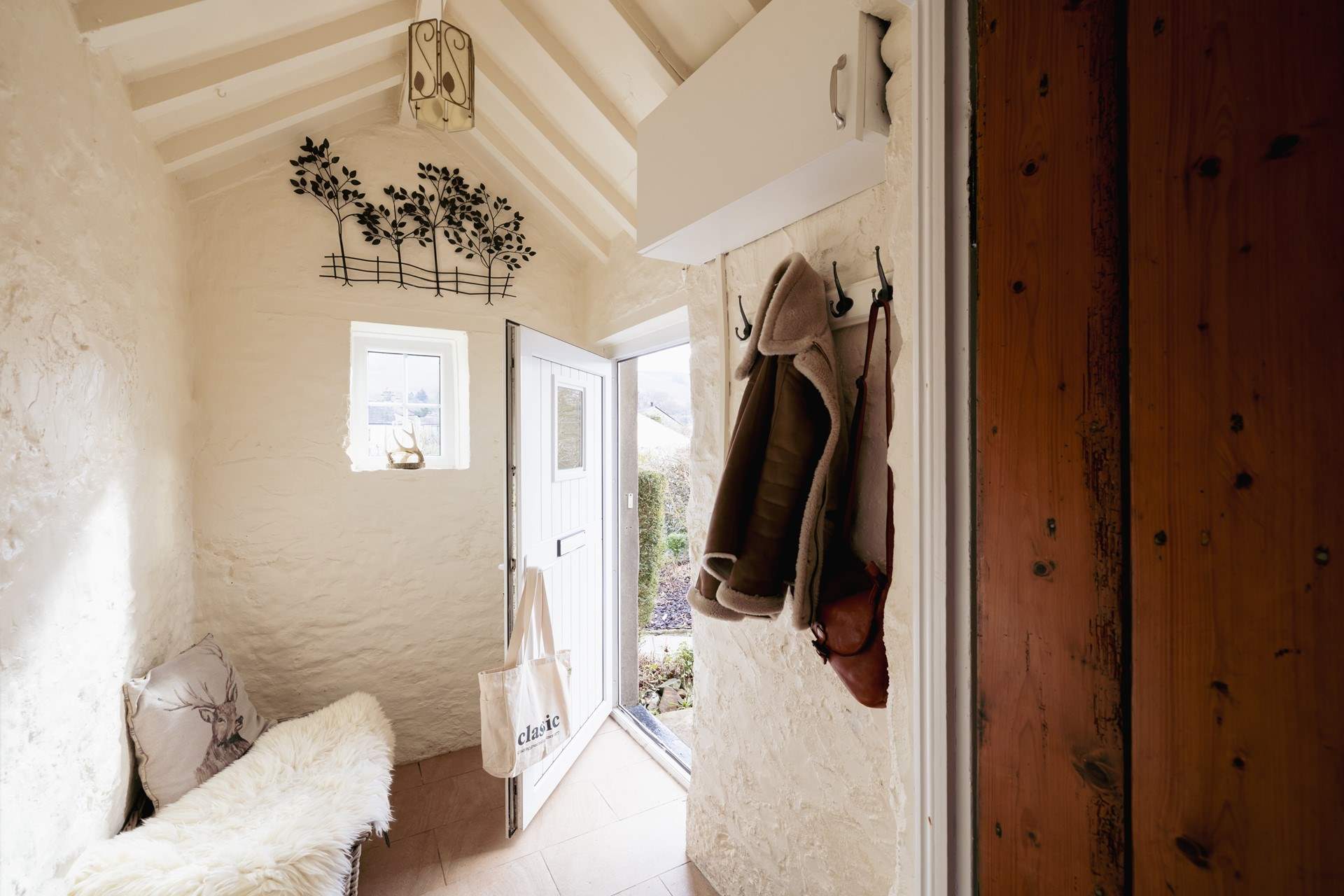 The entrance hall is a perfect place for coats, boots and a picnic basket.