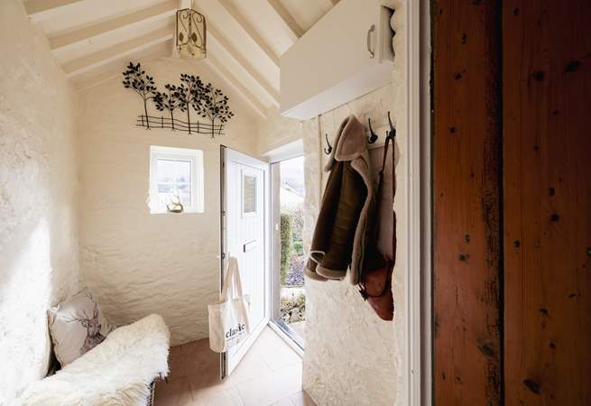The entrance hall is a perfect place for coats, boots and a picnic basket.