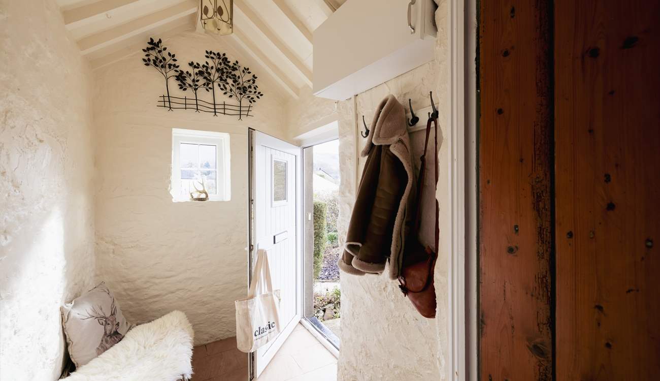 The entrance hall is a perfect place for coats, boots and a picnic basket.