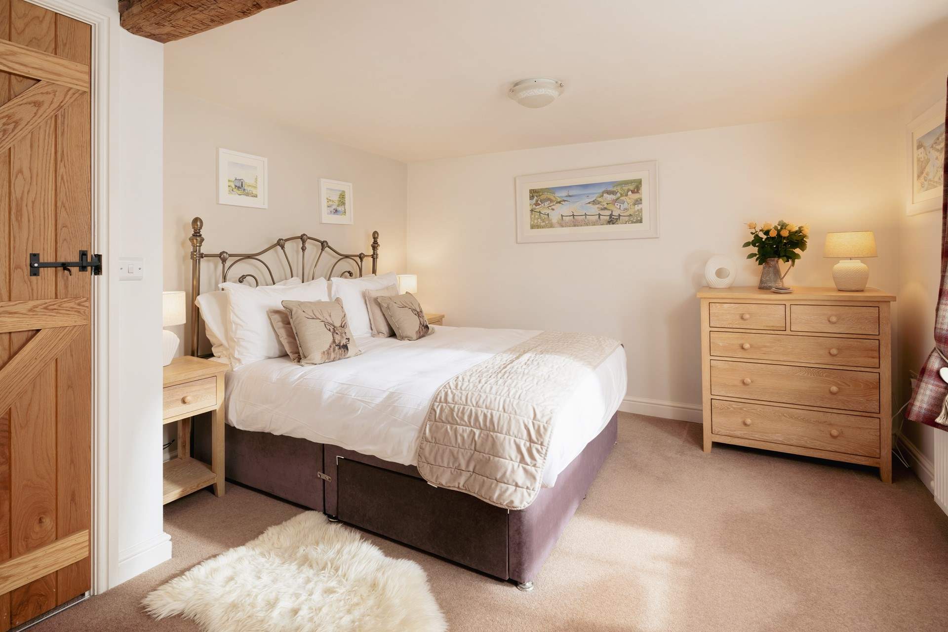 The king-size bedroom on the first floor welcomes you in for a great night's sleep.