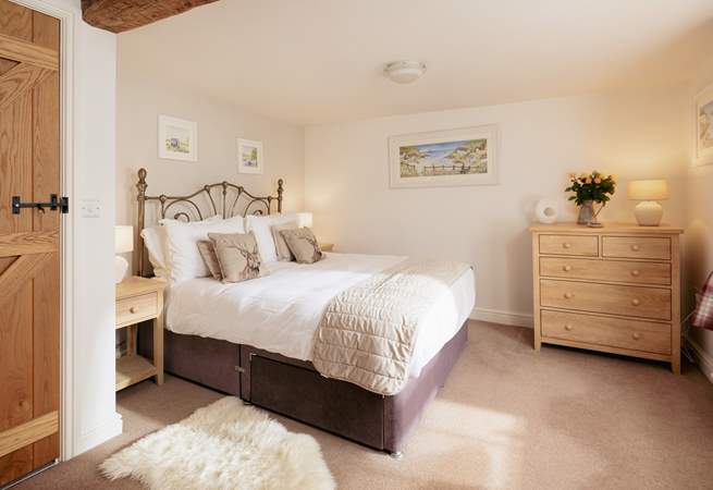 The king-size bedroom on the first floor welcomes you in for a great night's sleep.