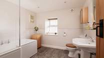 Bedroom 1 has it's own large bathroom, there is a shower over the bath for your comfort.