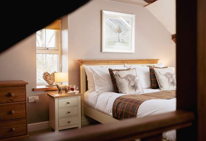 Bedroom 2 has a king-size bed, an en suite and amazing views.