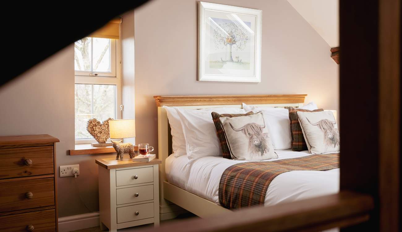 Bedroom 2 has a king-size bed, an en suite and amazing views.