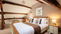 Relax and unwind in this delightful second floor bedroom. 