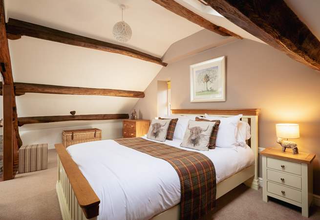 Relax and unwind in this delightful second floor bedroom. 