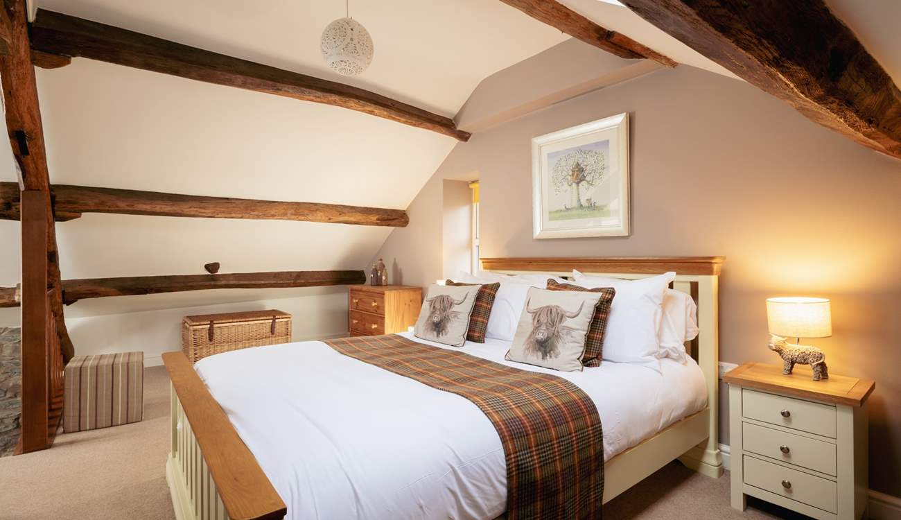 Relax and unwind in this delightful second floor bedroom. 